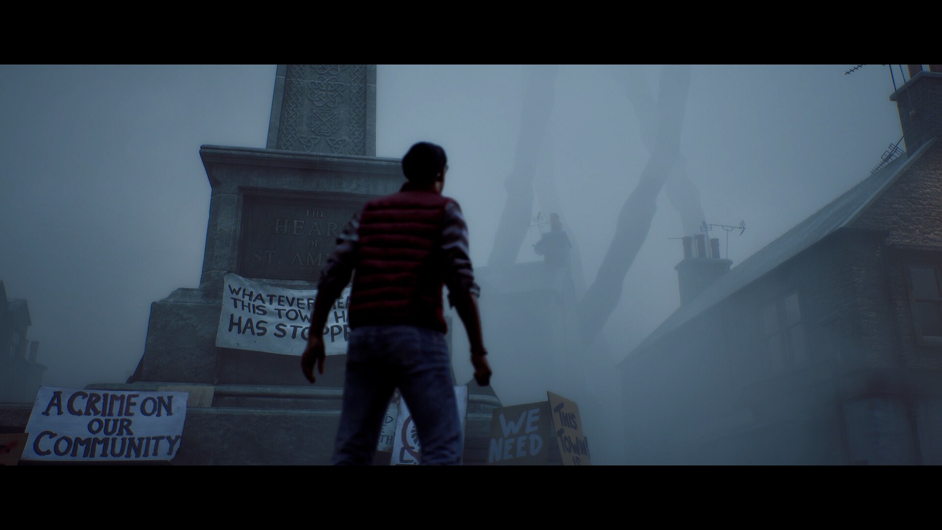 Simon Ordell facing a fog-covered monument in the town square of St. Amelia, surrounded by protest signs
